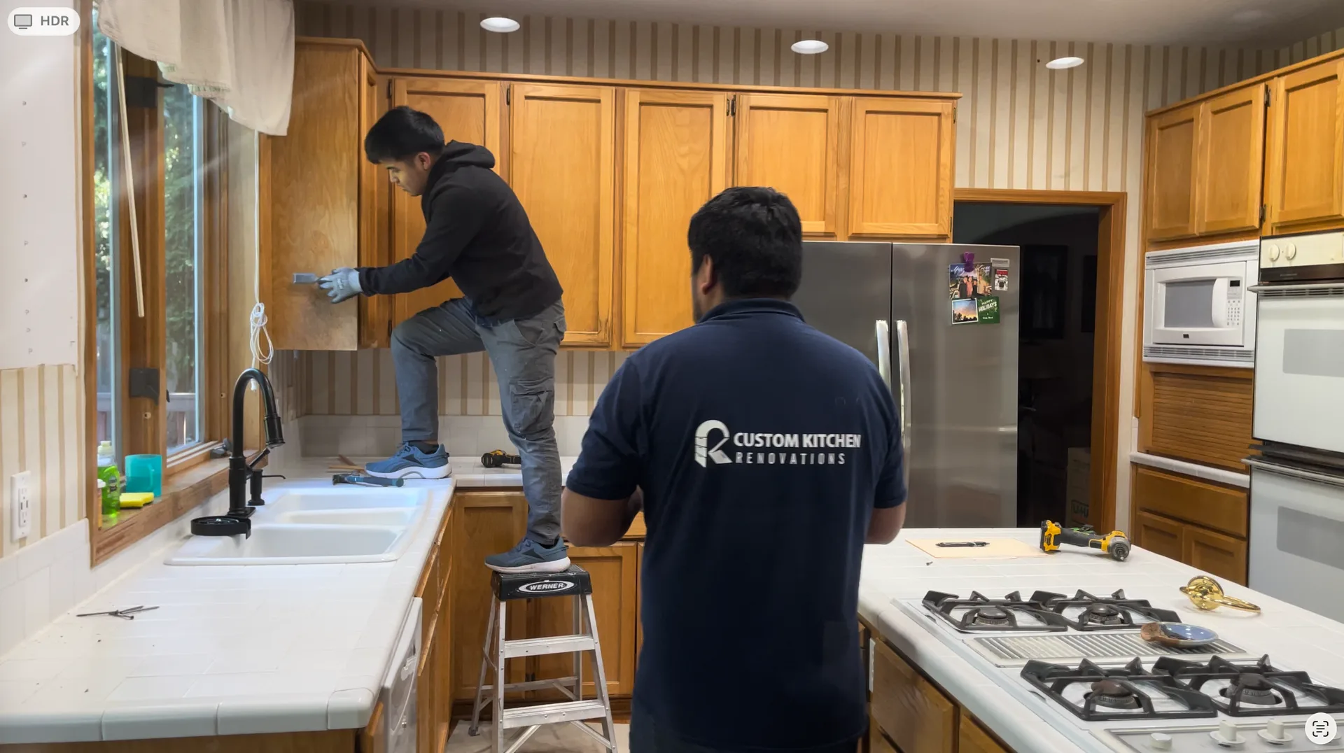 Master carpenters assembling custom cabinets in our shop